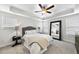 Serene bedroom with a king bed, large mirror, and neutral color palette at 547 Gateway Townes Blvd, Wake Forest, NC 27587