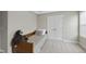 Neutral bedroom featuring carpet, a double door closet, and a twin size bed with plush sloth toy at 547 Gateway Townes Blvd, Wake Forest, NC 27587