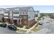 Stylish townhome featuring brick and siding facade with well-maintained landscaping at 547 Gateway Townes Blvd, Wake Forest, NC 27587