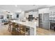 Bright kitchen featuring stainless steel appliances and a large island at 547 Gateway Townes Blvd, Wake Forest, NC 27587