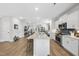 Open kitchen concept with a large island and breakfast bar at 547 Gateway Townes Blvd, Wake Forest, NC 27587