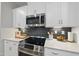 Modern kitchen featuring stainless steel appliances and quartz countertops at 547 Gateway Townes Blvd, Wake Forest, NC 27587