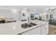 Spacious kitchen island featuring a double sink and seating at 547 Gateway Townes Blvd, Wake Forest, NC 27587