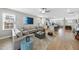 Spacious living room flows into the modern kitchen with large sectional couch at 547 Gateway Townes Blvd, Wake Forest, NC 27587