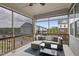 Cozy screened-in patio with comfortable seating and views of the neighborhood at 547 Gateway Townes Blvd, Wake Forest, NC 27587