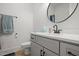 Well-lit bathroom featuring a sleek vanity, round mirror, and modern fixtures at 5750 Nc Highway 49, Burlington, NC 27215