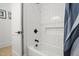 A modern bath and shower area showcasing white tile and matte black hardware at 5750 Nc Highway 49, Burlington, NC 27215