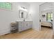 Bathroom features modern vanity, neutral colors, and doorway to main bedroom at 5750 Nc Highway 49, Burlington, NC 27215