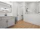 Stylish bathroom with a modern vanity, frameless mirror, and glass-enclosed shower at 5750 Nc Highway 49, Burlington, NC 27215