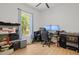 Bright, airy bedroom featuring a large window with natural light and computer setup at 5750 Nc Highway 49, Burlington, NC 27215