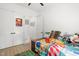 Bedroom featuring a colorful bed, neutral decor, and a ceiling fan at 5750 Nc Highway 49, Burlington, NC 27215