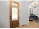Inviting entryway featuring a decorative glass front door and view into adjacent home office at 5750 Nc Highway 49, Burlington, NC 27215