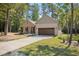 Charming brick home with a two-car garage and beautifully landscaped front yard at 5750 Nc Highway 49, Burlington, NC 27215