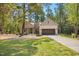 Beautifully landscaped brick home with a spacious driveway and well-kept lawn at 5750 Nc Highway 49, Burlington, NC 27215