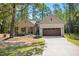 Charming brick home featuring a two-car garage, inviting front porch, and well-manicured lawn at 5750 Nc Highway 49, Burlington, NC 27215