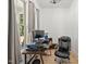 Bright home office with large windows, offering a comfortable and productive workspace at 5750 Nc Highway 49, Burlington, NC 27215