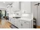 Kitchen featuring white cabinets, subway tile backsplash, quartz countertop, and stainless steel appliances at 5750 Nc Highway 49, Burlington, NC 27215