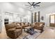 Spacious living room features a large fan, view to kitchen, and comfortable seating arrangements at 5750 Nc Highway 49, Burlington, NC 27215