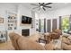 Comfortable living room showcasing fireplace, built-in shelving, and french doors to the outside at 5750 Nc Highway 49, Burlington, NC 27215