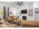 Cozy living room with fireplace, built-in shelving, and large windows for natural light at 5750 Nc Highway 49, Burlington, NC 27215