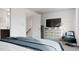 Bedroom with a chic color palette, soft textures, and a view into the en-suite bathroom at 681 Mirkwood, Apex, NC 27523
