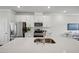 Close up of modern kitchen with stainless steel appliances and a bright white color palette at 681 Mirkwood, Apex, NC 27523
