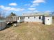 This home features a backyard with a deck, an above-ground pool, and a sunroom at 6825 Pulley Town Rd, Wake Forest, NC 27587