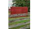 Rustic red barn with weathered fencing, set in a grassy pasture at 7027 Old 421 Rd, Liberty, NC 27298