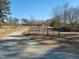 Long gravel driveway leading to the property through a gated entrance at 7027 Old 421 Rd, Liberty, NC 27298