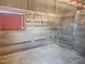 Cozy horse stall with wood walls, hay rack, and ample space at 7027 Old 421 Rd, Liberty, NC 27298