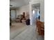 Living room with neutral carpet, comfortable reclining chairs and door to hallway at 7027 Old 421 Rd, Liberty, NC 27298