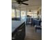Relaxing sunroom features a hot tub, wicker chairs, and an outdoor view at 7027 Old 421 Rd, Liberty, NC 27298
