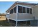 Charming screened-in back porch, perfect for enjoying the outdoors at 7027 Old 421 Rd, Liberty, NC 27298
