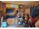 Organized tack room with wooden walls and ample storage for riding equipment and supplies at 7027 Old 421 Rd, Liberty, NC 27298