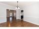 Dining room featuring hardwood floors, elegant lighting, and an open layout, great for entertaining at 74 Wildcat Ln, Cameron, NC 28326