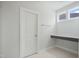 Bathroom with vanity, door and bright lighting at 749 Aristocrat Ln, Knightdale, NC 27545