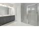 Bright bathroom with a glass shower, double vanity, and neutral finishes at 749 Aristocrat Ln, Knightdale, NC 27545