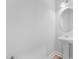A powder room with pedestal sink and framed oval mirror at 749 Aristocrat Ln, Knightdale, NC 27545