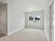 Bedroom with carpet, white trim, and natural light from double windows at 749 Aristocrat Ln, Knightdale, NC 27545