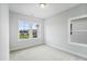 Bedroom with two windows, carpet, and neutral paint at 749 Aristocrat Ln, Knightdale, NC 27545