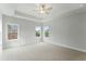 Spacious bedroom with three windows, recessed lighting, and a ceiling fan at 749 Aristocrat Ln, Knightdale, NC 27545