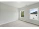 Bedroom with two windows, neutral carpet and paint at 749 Aristocrat Ln, Knightdale, NC 27545