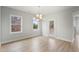 Dining room with natural light showcases chandelier and sliding doors to back deck at 749 Aristocrat Ln, Knightdale, NC 27545