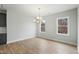 Dining room features natural light, hardwood floors, and access to kitchen at 749 Aristocrat Ln, Knightdale, NC 27545