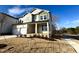 Charming two-story home featuring a two-car garage and craftsman style front porch at 749 Aristocrat Ln, Knightdale, NC 27545