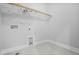 Laundry room with tile flooring, utility sink, and storage space at 749 Aristocrat Ln, Knightdale, NC 27545