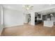 Bright open-plan living room has hardwood floors and an open floor plan to the kitchen and staircase at 749 Aristocrat Ln, Knightdale, NC 27545