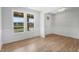 Bright living room with large windows, hardwood floors, and classic trim, perfect for entertaining at 749 Aristocrat Ln, Knightdale, NC 27545