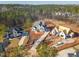 Aerial view of a property with a long driveway, showcasing the neighborhood's landscape and other new homesites at 7825 Ailesbury Rd, Wake Forest, NC 27587