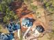 An aerial view of a new construction home surrounded by beautiful trees at 7825 Ailesbury Rd, Wake Forest, NC 27587